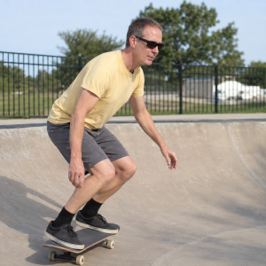 Robert Portillo skateboarding in a concrete bowl